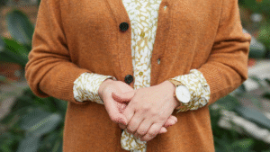 Woman wearing a 2025 fall maxi sweater dress in beige with Women's Fashion stylish leather boots